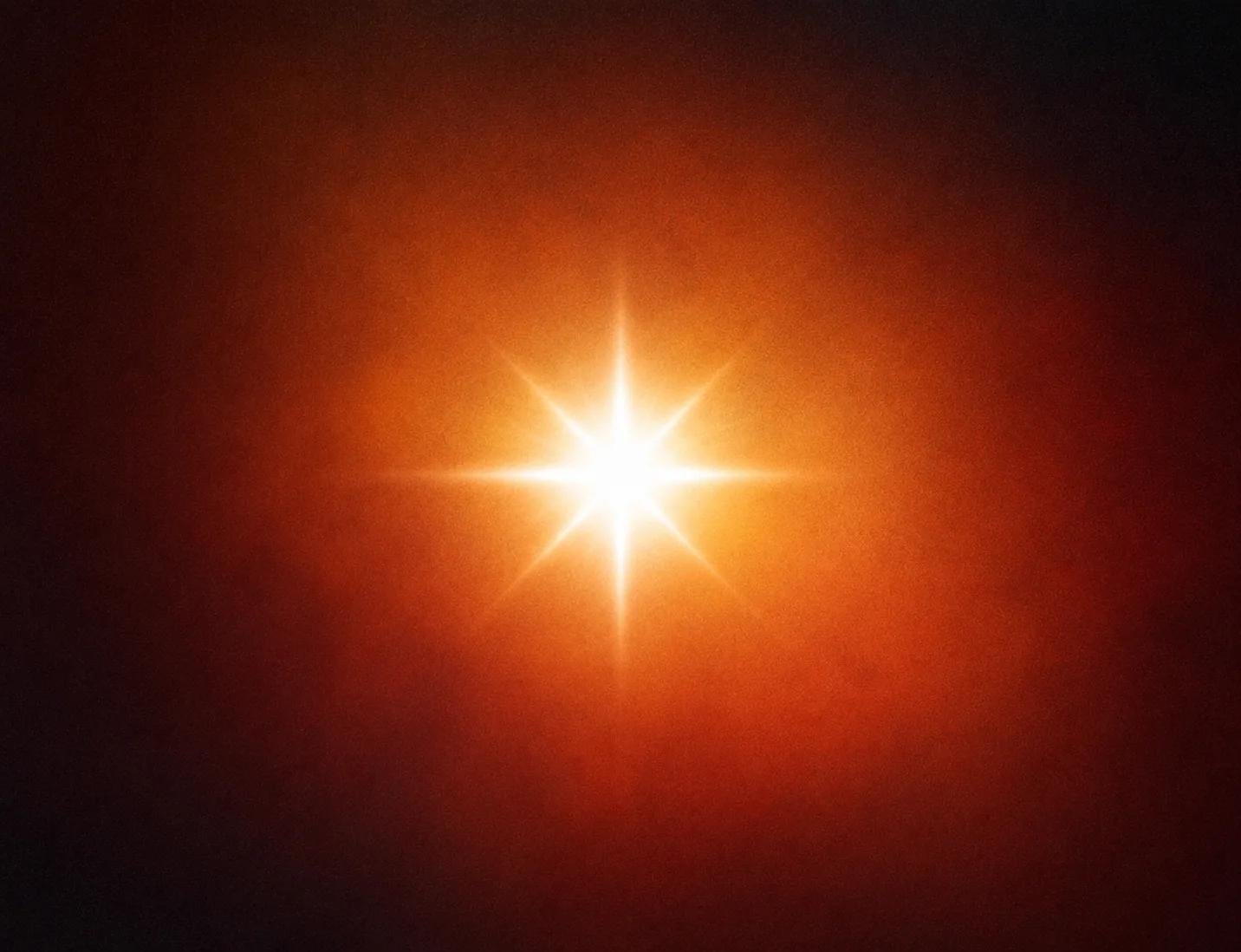 A bright warm star glowing through an amber haze